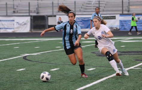 Sophomore Sofia Varmeziar chases a ball while Granger sophomore Malone Aldridge attempts to keep up. Varmeziar scored one goal, and she was a large contribution to the offense, making skilled passes that helped move the ball around the field.