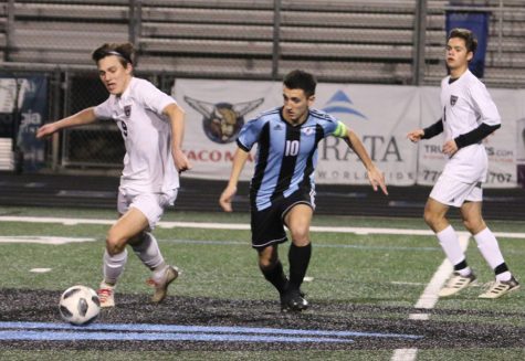 Senior Ryan Shanahan fights for possession of the ball against a Whitewater player. For most of the first half, the Panthers were able to keep the ball on their side of the field. However, they failed to score on several attempts.