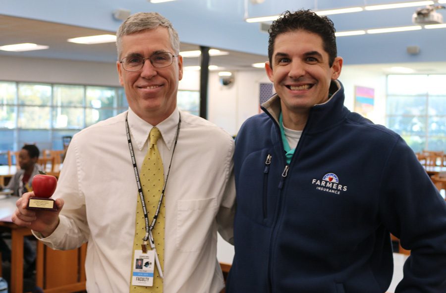 March’s Golden Apple recipient, Rick Wright, poses with Tim Monihan from Farmers Insurance. One of the most important things to Wright is that the students at Starr’s Mill have meaningful experiences during their high school careers.