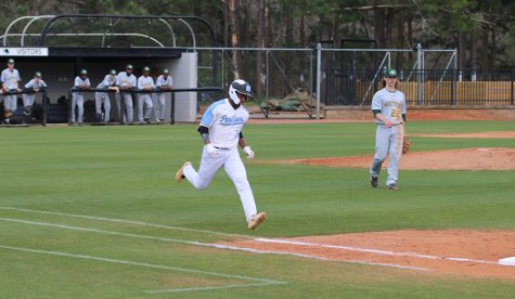 Sophomore Thad Ector runs toward first base. The Panthers were down 4-0 after the first inning. However, an offensive onslaught saw them take over the game and force a mercy rule victory 14-4.