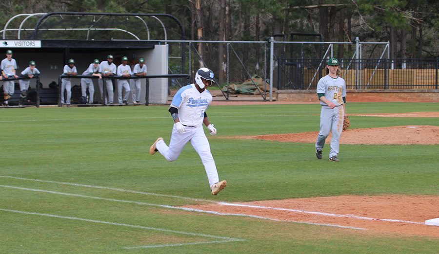 Sophomore Thad Ector runs toward first base. The Panthers were down 4-0 after the first inning. However, an offensive onslaught saw them take over the game and force a mercy rule victory 14-4.