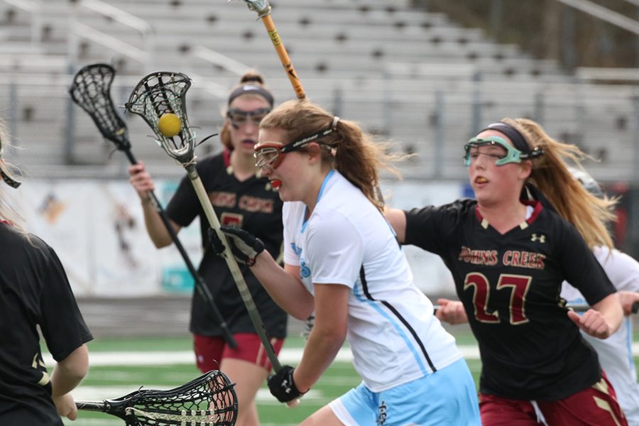 Junior Ryanne King sprints past Gladiator defenders. King did all she could for the Mill, scoring six of their nine goals. She has played a huge role in the offense’s 102 goals scored this year.
