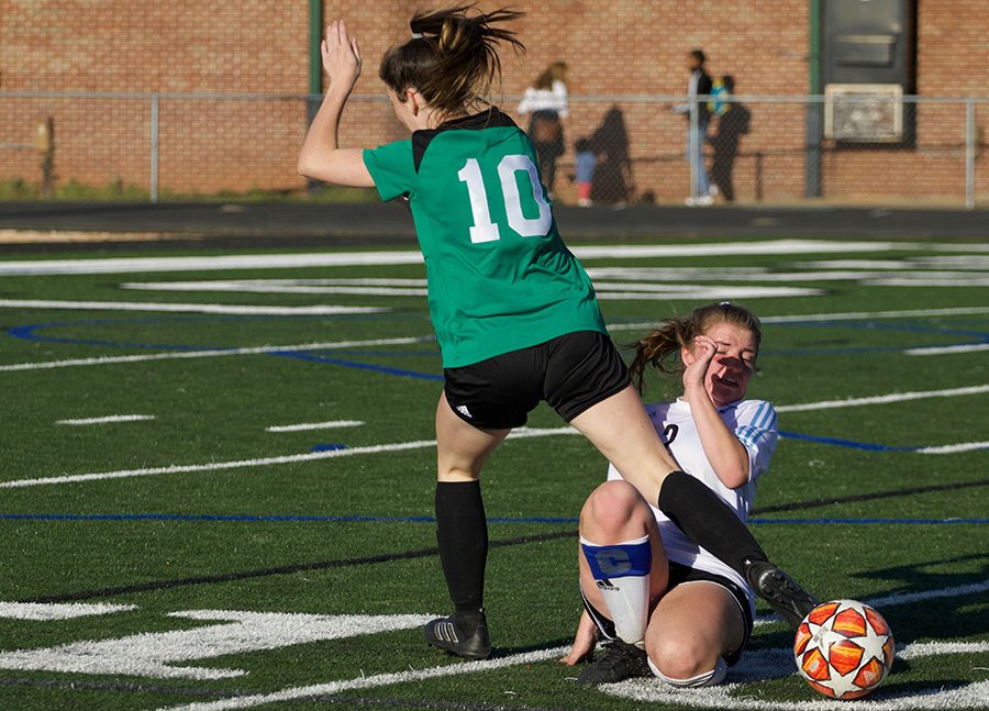 Junior Chief Annie O’Neill kicks the ball while senior Panther Rachel Davison slides to knock it away. The Battle of the Bubble game was full of aggression, and McIntosh held the ball for the majority of the game. The Lady Panthers switched up their line up, which led to some kinks in communication and mishandling of the ball.