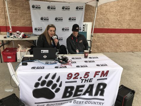 Panther alumna, Stephanie Johnson, sits down to talk with NASCAR Xfinity Series driver, Brandon Brown, in the 92.5 The Bear booth during race weekend at Atlanta Motor Speedway. Growing up a NASCAR fan, Johnson now records race recaps for the local radio station.