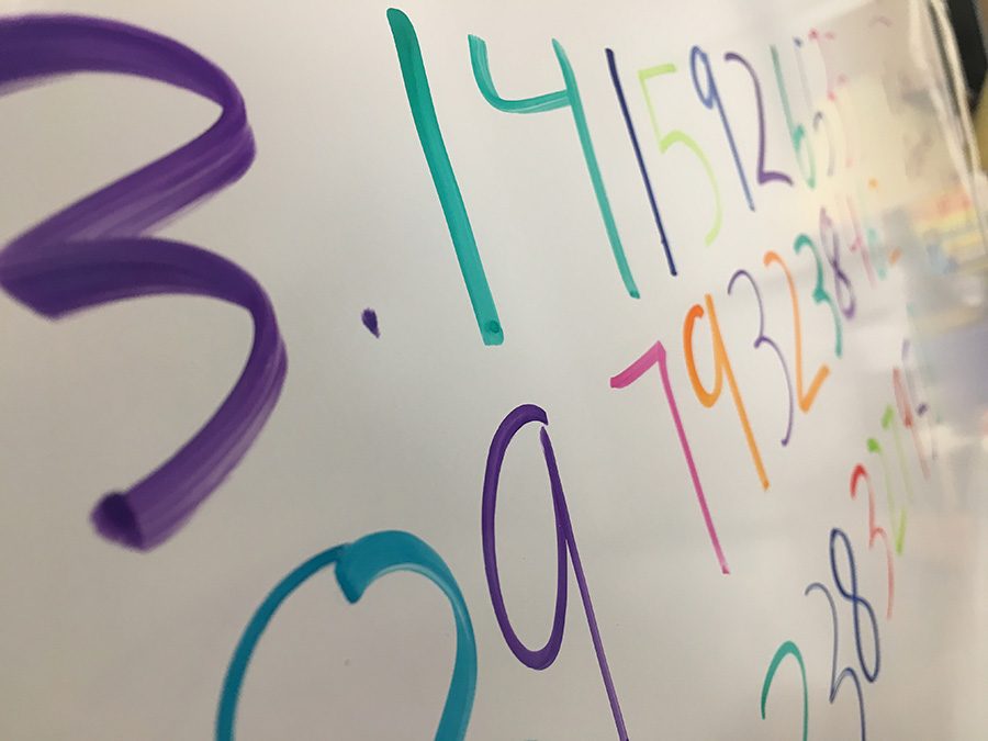 The number being expressed on the board is Pi, one of the most useful real numbers in math, specifically trigonometry. Because the Math team competition was on Pi Day, there was a scavenger hunt that helped boosting their morale and drive for math. 