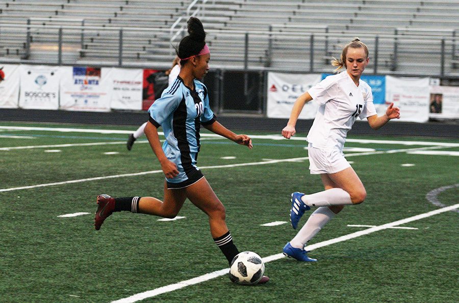 Sophomore Sara Evans dribbles the ball toward the goal. Evans had one goal and one assist in the game against Whitewater. The Lady Panthers shut out the Wildcats 4-0 improving their region record to 2-0.