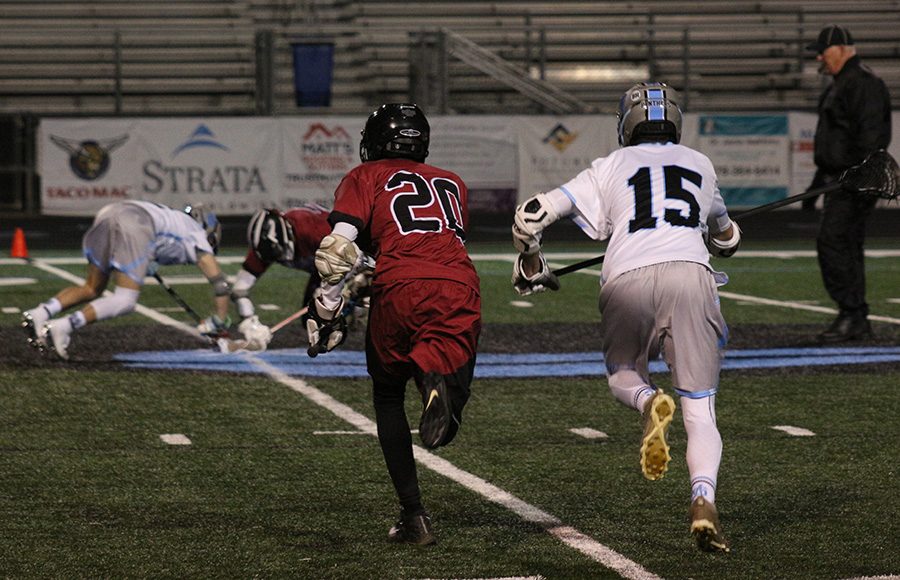 Junior Garrett Meunick fights for possession during a faceoff. Meunick went a perfect 16 of 16 on faceoffs in the win against Northgate, giving the Panthers an automatic advantage on the offensive end. 