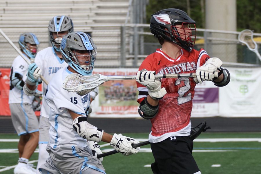 Senior Panther Jacob Zellen defends junior War Eagle James Mayfield. Mayfield scored four times against the Mill and led Woodward to their 10th win of the season. The War Eagles are now 3-0 in the area and have clinched a No. 1 seed in the state tournament.