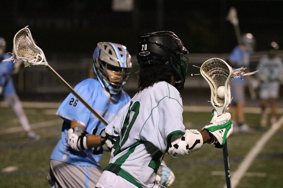 Sophomore Gabe Fernandez defends junior Chief Jabari Holifield. The Starr’s Mill defense locked down McIntosh in the second half, only allowing one goal. The Panther offense scored nine goals in the half, leading to the Mill clinching a home playoff game in the first round.