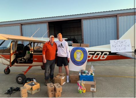 Aviation Club president senior Preston Harris (right) and his father, Huey Harris (left), stand in front of their Cessna 172 airplane alongside the donations that were collected for the victims of tornadoes in southeast Alabama. The donations came from Starr’s Mill students and other local businesses.