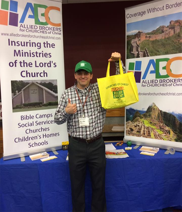 Starr’s Mill alumnus Austin Watts poses in front of an insurance display at a convention in Tennessee. Watts is currently an agent for Arroyo Insurance Services.