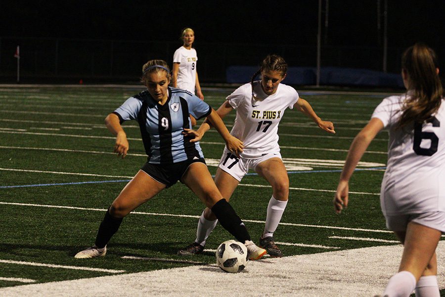 Freshman Lady Panther Sophia Bernardi attempts to keep junior Golden Lion Laney Polvino away from the ball. In the last regular season home game, Starr’s Mill faced St. Pius X. The Mill was defeated 3-0 after struggling to keep control of the ball.