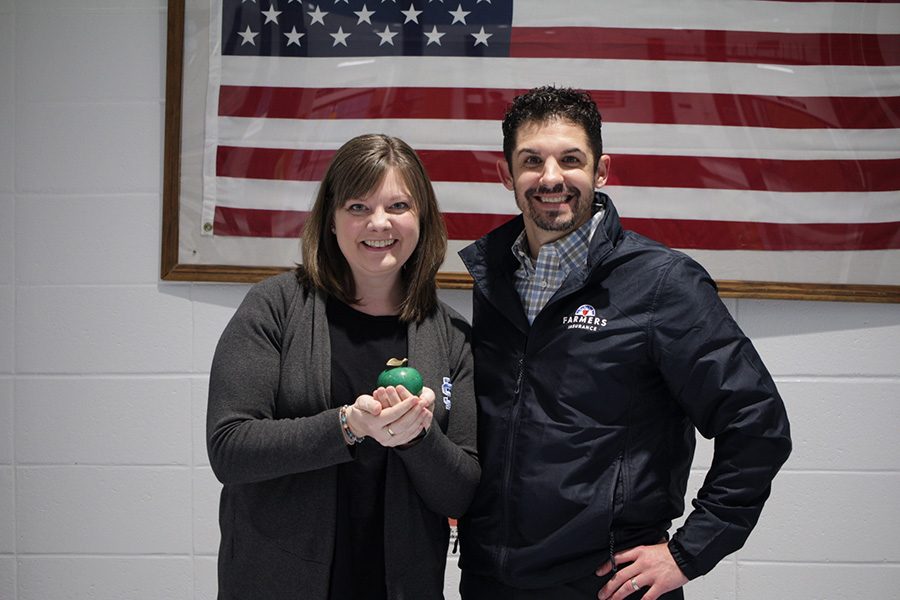 Tim Monihan from Farmers Insurance pictured next to this month’s Golden Apple winner, Dr. Lela Crowder. Crowder has been selected for this award by previous winner, Rick Wright, because he thought she had gone above and beyond what other teachers do to make a newcomer feel welcome.