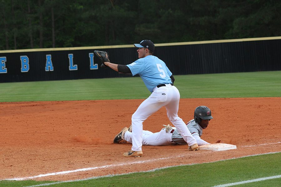 Senior Ryan Henderson attempts to catch a runner stealing. The Panther defense played tremendously in the final two games of the series, only allowing two combined runs.