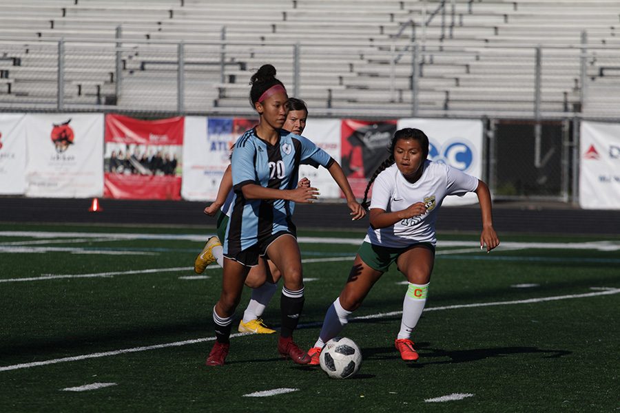 Sophomore Sara Evans dribbles the ball while being chased by two defenders. Evans scored three of the five goals for the Lady Panthers in the first round of playoffs against Ware County. Starr’s Mill defeated the Gators 5-0 in a game that amped up in the second half.