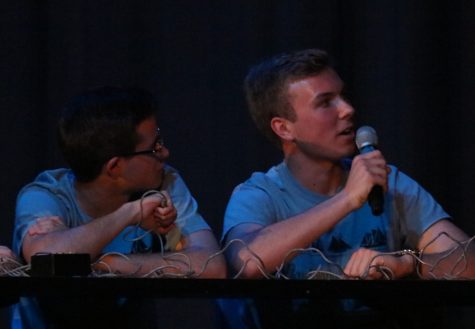 Seniors Jordan Botte (left) and Rhett Perry (right) answer questions during the History Bowl Smackdown. The students defeated their teachers after being behind at halftime. The social studies department hosted the event to help pay for the History Bowl team’s trip to nationals.