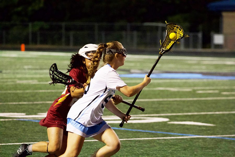 Freshman Kathryn Lehman runs past a Holy Innocents defender. Starr’s Mill used a dominant transition game to jump out to a 13-goal lead over the Lady Bears. Their defense forced turnovers and halted any momentum Holy Innocents gained.