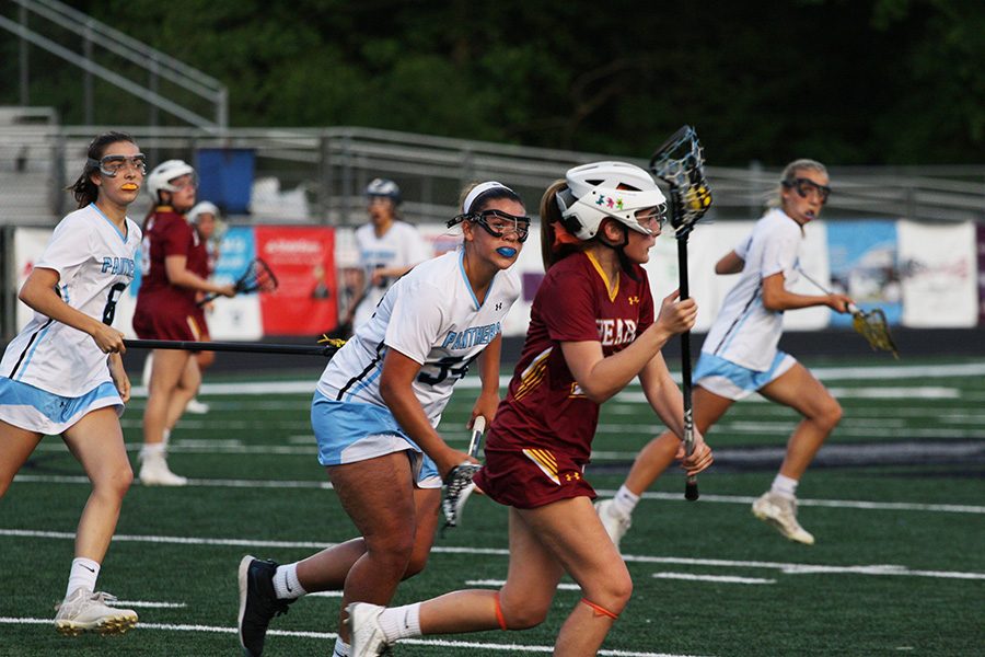 Senior Ansley Wallace chases down a Lady Bear player. Wallace and King combined for 12 goals against Holy Innocents in the Mill’s 19-7 win. Wallace missed last season’s run to the state championship with an injury, but she her impact has been felt for the Lady Panthers this year.
