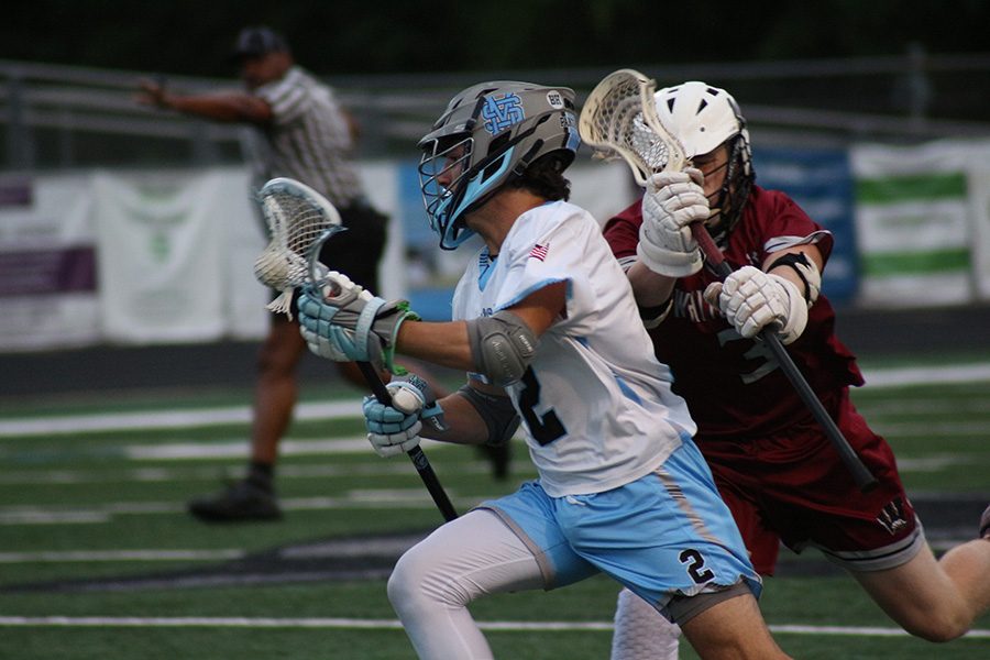 Junior Garrett Meuninck runs down the field after winning a face-off. Meuninck won 10 of 11 face-offs against Whitewater, contributing to their 11-0 win. The Panthers outscored Whitewater 27-1 in two meeting with the Wildcats this season.