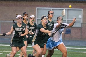 Senior Alyssa Angelo battles a pack of Lady Wolves for possession. The Lady Panthers started slow, but they closed the first half on an 8-1 run that carried them to a 21-11 victory. With the win, Starr’s Mill advanced to the Final Four of the GHSA State Playoffs.