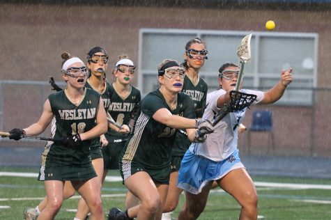 Senior Alyssa Angelo battles a pack of Lady Wolves for possession. The Lady Panthers started slow, but they closed the first half on an 8-1 run that carried them to a 21-11 victory. With the win, Starr’s Mill advanced to the Final Four of the GHSA State Playoffs.