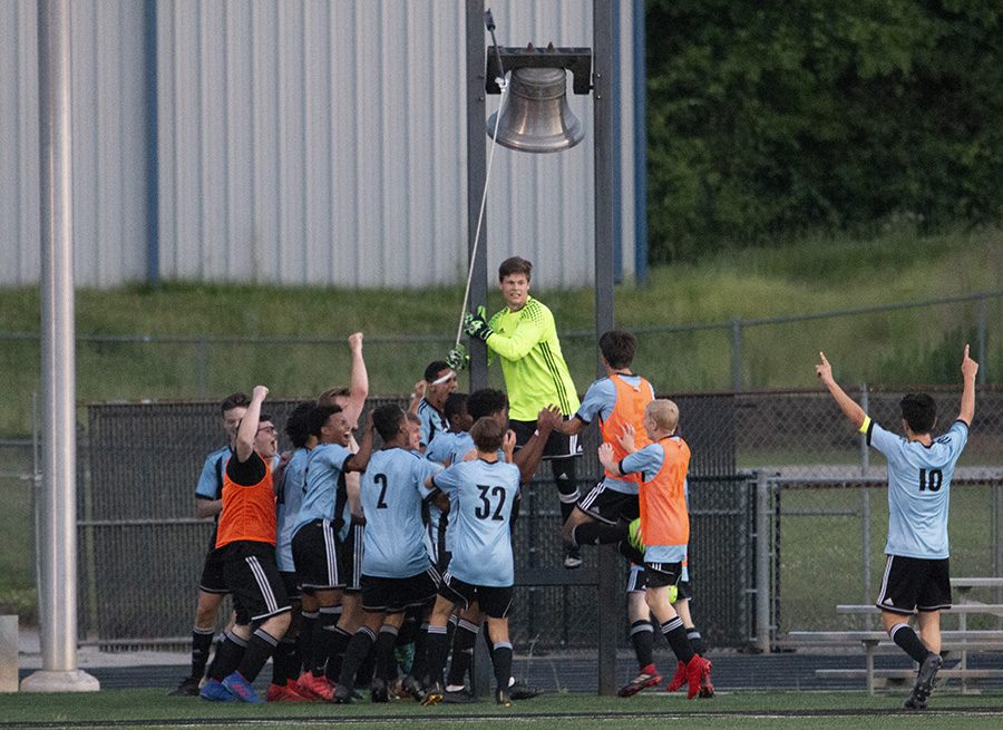 Senior Michael Lantz rings the victory bell as the rest of the team celebrates. The Panthers defeated Johnson 2-0 after losing to them 4-0 in the Final Four last year. This win sets up a Battle of the Bubble against McIntosh for the AAAAA GHSA State Championship.