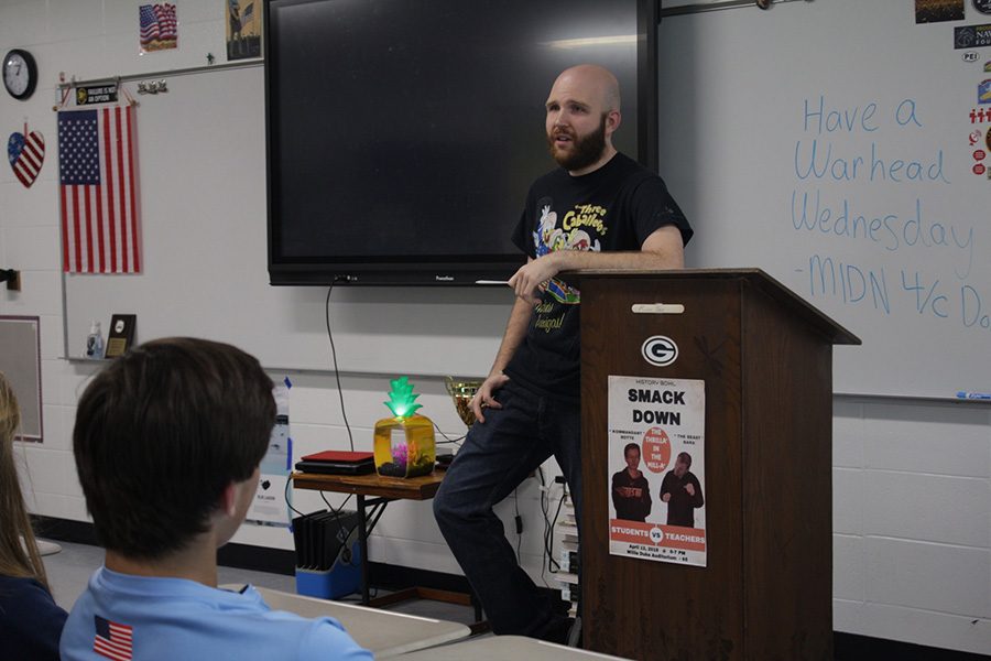 Award-winning student teacher Jeffrey Foley talks with his students during a celebration recognizing his accolades and his time teaching at Starr’s Mill.  “Its hard work being a teacher,  but its one of the most rewarding things that you can do,” Foley said.