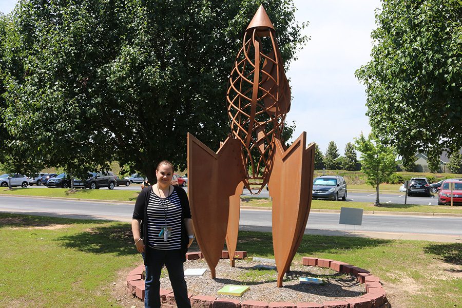 Alejandra Brujin poses in front of the rocket outside of Peeples Elementary. Earlier this school year Peeples Elementary started a foreign language class where they currently teach Spanish. The class has had positive impact on students and is planned to advance in the future. 