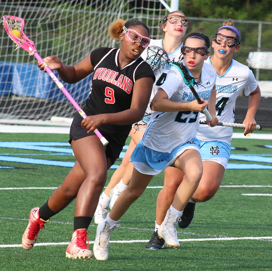 Freshman Hannah Leon chases down a Woodland player. Leon scored three goals all in the first half against the Wolfpack. She joined four other Lady Panthers that had a hat trick in the team’s win.