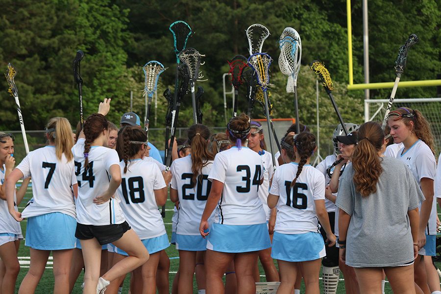 The+Lady+Panther+lacrosse+team+huddles+together+after+their+win+over+Woodland.+The+Lady+Panthers+defeated+the+Wolfpack+20-1+in+the+opening+round+of+the+state+playoffs.+Starr%E2%80%99s+Mill+looks+to+return+to+the+state+championship+game+after+finishing+runner-up+to+Blessed+Trinity+last+year.