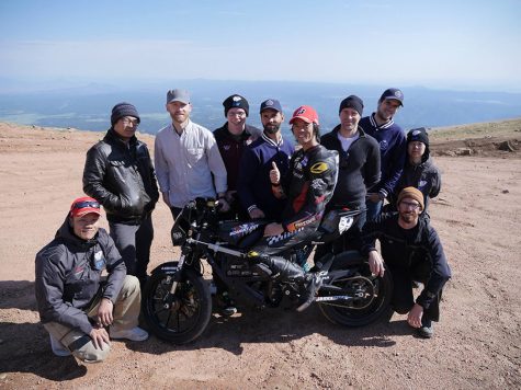 Panther grad Kento Masuyama (lower left) poses with his electric motorcycle racing team at Pikes Peak, Colorado. Masuyama now lives in Tokyo where he works as a satellite systems and propulsion engineer. 