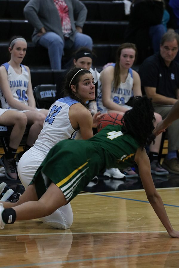 Angelo dives for a lose ball against Griffin. Angelo is known for her hustle as an athlete. In every sport she played, she displayed a great nose for the ball.