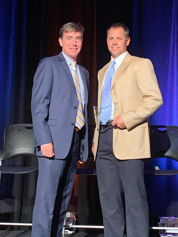 Track and field head coach Chad Walker accepts the Hawthorne Wesley Coach’s Dedication Award. The Starr’s Mill track team had a great showing this season, breaking nine school records en route to Walker earning this honor. The Atlanta Track Club’s highest coaching award can only be earned once in a coaching career. 