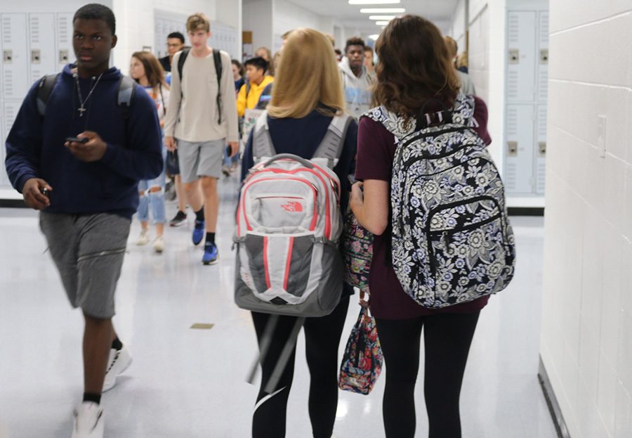 Students wearing bookbags leave their classes after the end of seventh period, the only period of the day when bookbags are allowed in classrooms. The administration argues that this new policy will provide the school with more safety, but in reality, it only creates more inconveniences for the students. 