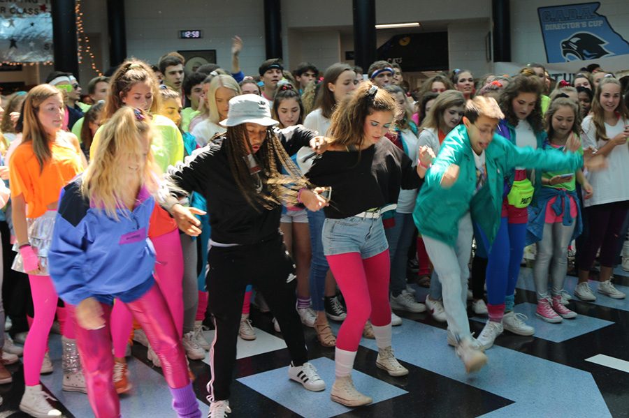 Students participate in the flash mob for Decades Day. Since students dressing up is not mandatory, it only makes sense to allow students to also choose whether or not they want to participate in the pep rally. 