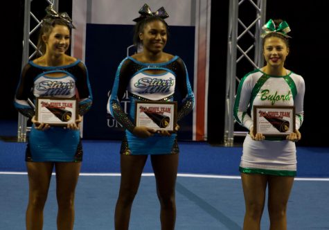 Tori Davis (middle) and Hannah Defler (left) at last year’s cheerleading awards. Davis was named top 16 in the state and now joins the Texas A&M competition squad. 