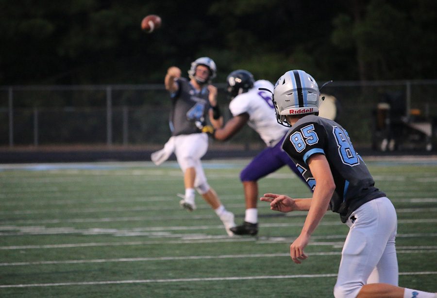 Senior Hunter Lawson throws the ball against Chapel Hill. Lawson found great success from the air in the loss, completing five of his nine pass attempts for 147 yards, two touchdowns, and one interception.