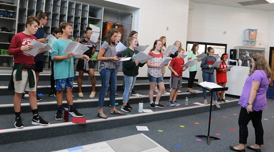 Middle school chorus teacher Bonnie Krider conducts the mixed choir.  The annual fall concert will be at 6:30 p.m. on Sept. 26 at Willie Duke Auditorium. 