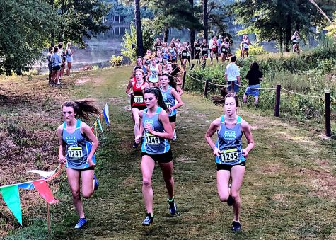 Juniors Darby Olive, Allie Walker, and Erin Schmidt (left to right) lead the pack in the 8th Annual AT&T Panther Invitational. Both varsity teams from Starr’s Mill led all Fayette County schools as the girls finished 2nd and the boys placed 3rd.