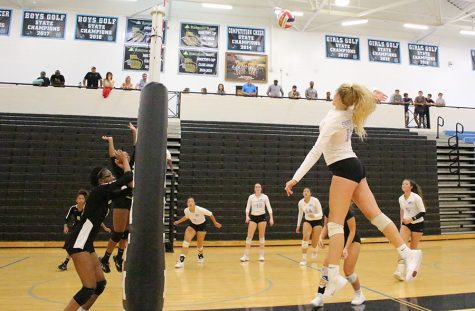 Sophomore Nicole Smith sets up for a kill. Smith has led the team with 188 kills.