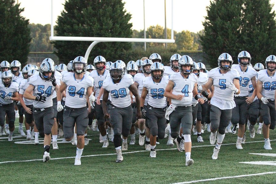 The Panther football team runs onto the field before the game. A more well-rounded game was played by Starr’s Mill, using both offense and defense to their advantage in the 28-0 win over Northgate.