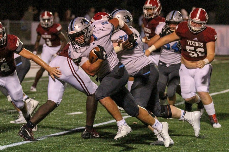Senior Ben Bodne runs the ball against Northgate. Bodne picked up right where he left off against Mt. Zion, running for 140 yards on 21 carries and three touchdowns.