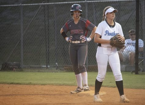 Junior Madilyn Cochran lined up on first base after a single hit. Cochran contributed two runs and a hit to the Wildcat offense.