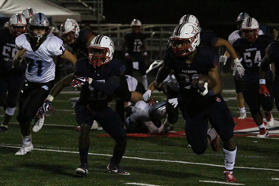 Senior Patriot Rashad Amos runs the ball against the Panthers. Amos, a Western Kentucky University commit, ran for 84 yards on 11 carries and three touchdowns. 