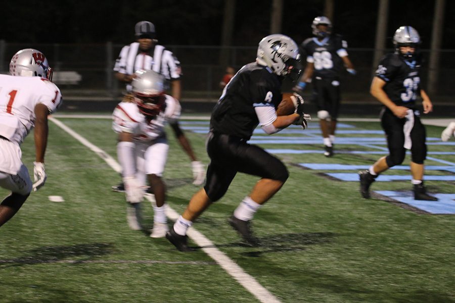 Senior Ben Bodne crosses the goal line for a touchdown. Bodne had another monster game last week, rushing for 103 yards and three touchdowns. On the season, Bodne has 566 rushing yards and 11 touchdowns.