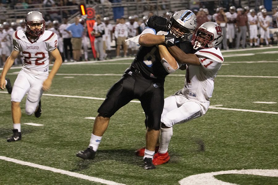 Junior Cole Bishop gets tackled after an interception. Bishop led the Panther secondary in the win over the Wildcats, forcing three of the teams four interceptions. 