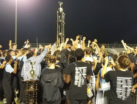 Members of the Starr’s Mill marching band celebrate after earning Grand Champions in the first competition of the year. They compete again on Oct. 5 in the Sound of Freedom marching band competition in Warner Robins.