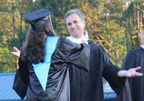 Physics teacher Craig Martin readies his arms to embrace his daughter Madison during graduation ceremonies for the class of 2019. This year, the Prowler looks to highlight Starr’s Mill alumni who are related to faculty and staff.