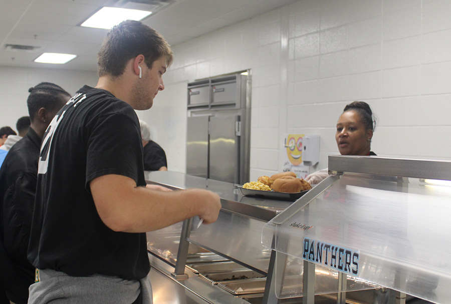Senior Gabe Jones is served chicken nuggets, a whole-grain roll, and mac-and-cheese. This is an example of a common school lunch in the nation, and demonstrates the re-formulating of products to fit government guidelines. Students like Gabe need better quality food and more time to genuinely enjoy it. 
