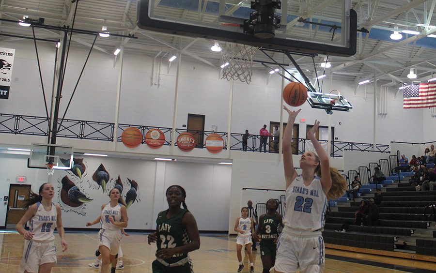 Sophomore Jaclyn Hester shoots a layup. Hester led the girls in scoring with 17 points.